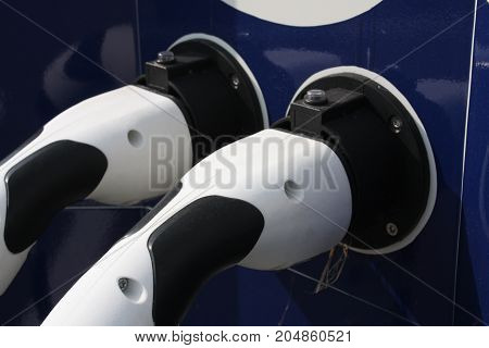 two connectors for Charging electric car. eco energy concept