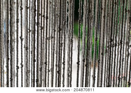 White macrame curtain made with rope. Handmade craftwork.