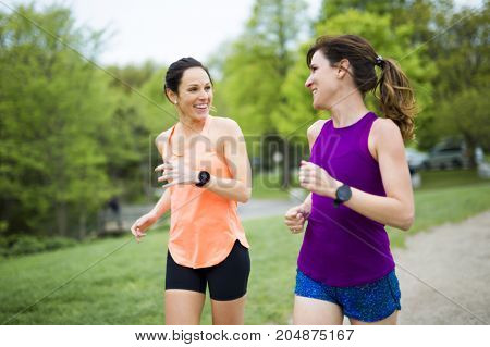 Two Beautiful Female runner outside having fun