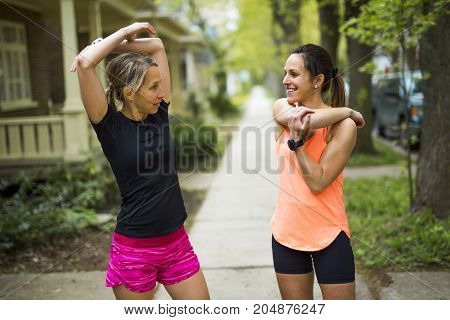 Two Beautiful Female runner outside having fun