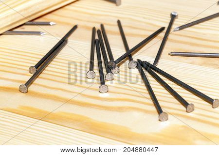 The Construction Of A New Floor From The Pine Board In The Room. Nails Lying On Wooden Boards And Ph