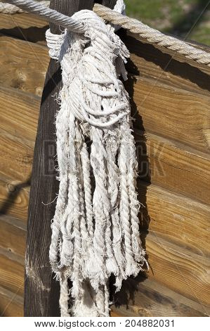 Ship Tied White Rope. Photo Close-up, Focus On The Knot