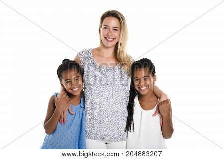 Two Afro twin child posing on a white background studio with white mother