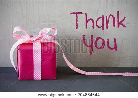 Gray Grungy Cement Wall With English Text Thank You. Pink Gift Or Present With Bow.