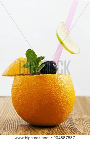 Half An Orange With Other Fruits, And Are Closed By The Second Half.