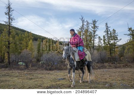 huvsgul Mongolia September 11th 2017: mongolian man with his horse
