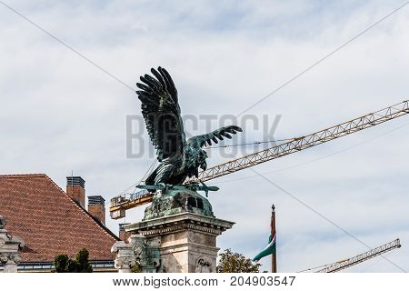 Budapest, Hungary - August 12, 2017:  Turul statue in the Castle of Buda. The Turul is a mythological bird of prey in Hungarian tradition and a national symbol of modern Hungary.