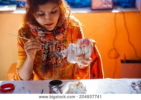 yong Woman making a dwarf figure. Creative concept