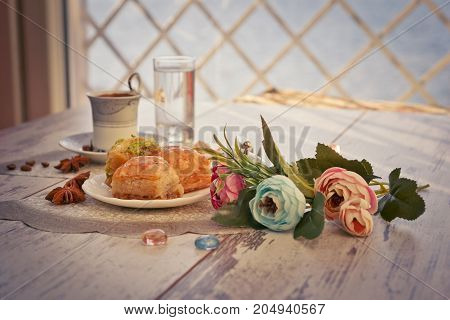 Cup Of Turkish Coffee And Plate With Baklava