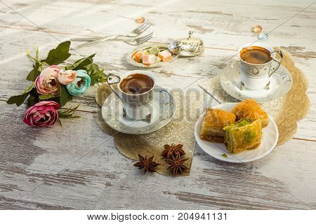Cups Of Turkish Coffee And A Plate With Baklava