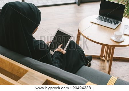 Muslim Woman Using Tablet