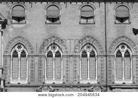 Bologna (Emilia Romagna Italy): facade of historic building in a sunny morning. Black and white