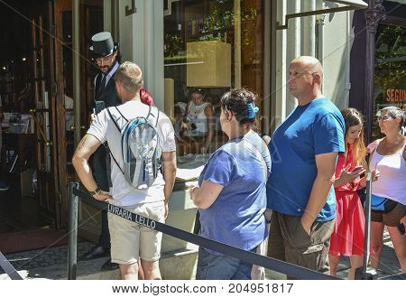 PORTOPORTUGAL - AUGUST 10 2017 : Turn of tourists at the entrance to the Livraria Lello bookstore Porto Portugal