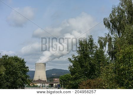Nuclear power plant with traffic street and tree pollution sky