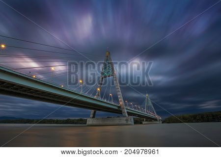Budapest Hungary - The Megyeri Bridge over river Danube at dusk with dramatic moving clouds