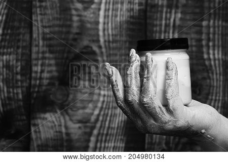 Female Hand Holding Jar
