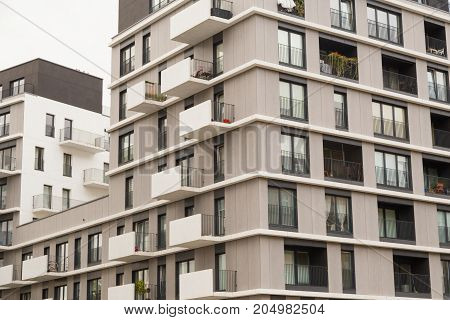 Contemporary design of multifamily living houses. Modern luxury apartments buildings