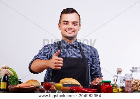 Image of hot dog cooking concept. Isolated on white background. Fast food concept. Tasty. Smiling men.