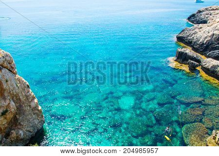 Sea caves of Cavo greco cape. Mediterranean sea landscape skyline