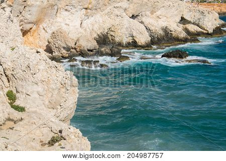 Sea caves of Cavo greco cape. Mediterranean sea landscape skyline