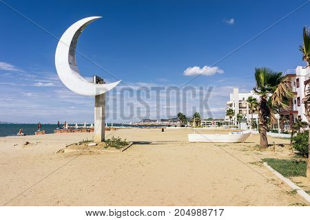 ALBANIA GOLEM- September 21 2015: Beach resort Golem with one of the main symbols of Albania crescent on the pedestal