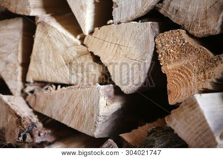 Split Fire Wood. Dried, Split and Stacked Firewood. Old Dried Dead Trees cut up and split in to pieces for future fires and wood burning stoves and fireplaces. 
