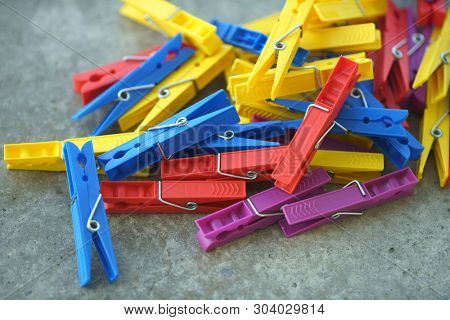 Colorful Plastic Clothespins, Clothes Pegs, Clothespins Collection, Background and Texture of Scattered Clothespins, Lots of Clothespins