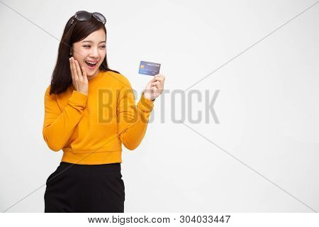 Happy Asian Woman Holding Credit Card Or Cash Advances, Pay Instead Of Money And Specially Curated B