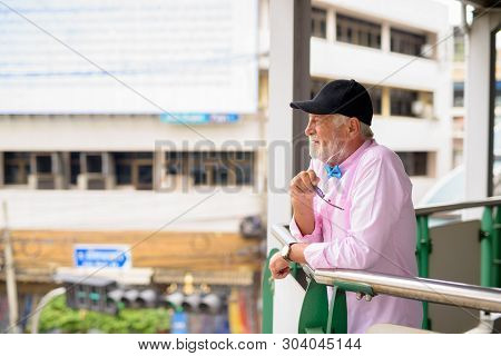 Handsome Senior Tourist Man Exploring The City Of Bangkok, Thail