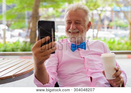 Handsome Senior Tourist Man Exploring The City Of Bangkok, Thail