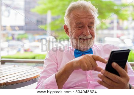 Handsome Senior Tourist Man Exploring The City Of Bangkok, Thail