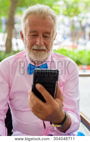 Handsome Senior Tourist Man Exploring The City Of Bangkok, Thail