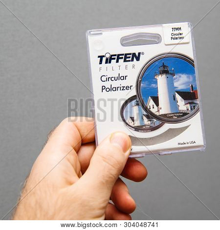 Paris, France - Jan 3, 2018: Man Hand Holding Against Gray Background Professional Tiffen Circular P