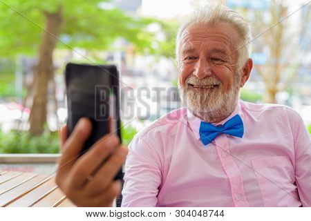 Handsome Senior Tourist Man Exploring The City Of Bangkok, Thail