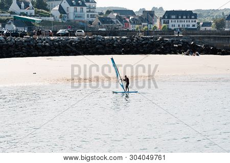 Morgat, France - August 4, 2018: Windsurfer In The Beach Of Morgat A Sunny Day Of Summer