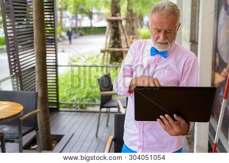 Handsome Senior Tourist Man Exploring The City Of Bangkok, Thail