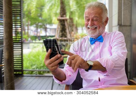 Handsome Senior Tourist Man Exploring The City Of Bangkok, Thail