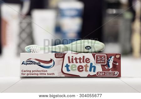Poznan, Poland - March 8, 2019: Box Of Toothpaste Standing On A Bathroom Sink In A Home.