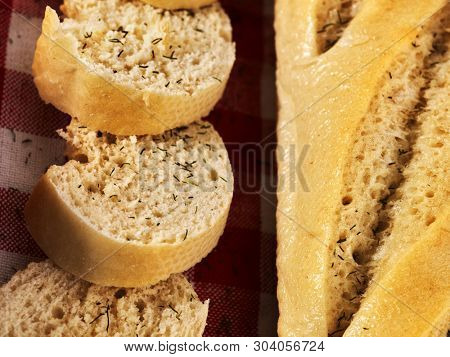 Bread bagget cut into sliced pieces close up.