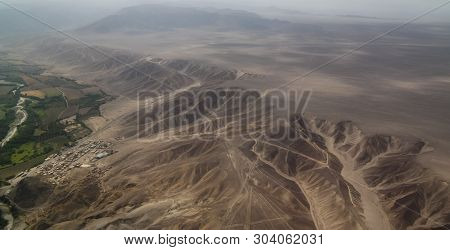 Aerial Airplane Panoramic View To Nazca Plateau With Geoglyph Lines , Ica Region, Peru