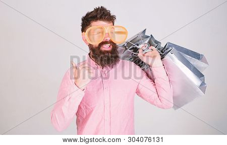 How To Get Ready For Your Next Vacation. Man Bearded Hipster With Lot Shopping Bags. Shopping On Bla