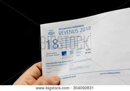 Paris France - Apr 9, 2019: Man Holding Declaration Des Revenus Preremplie Income Pre-filled Stateme