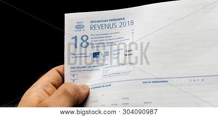 Paris France - Apr 9 2019: Man Holding Declaration Des Revenus Preremplie Income Pre-filled Statemen