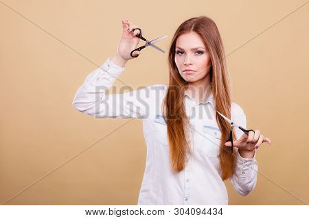 Haircare Concept. Cutting And Trimming. Young Prefessional Female Barber Hairstylist With Scissors. 