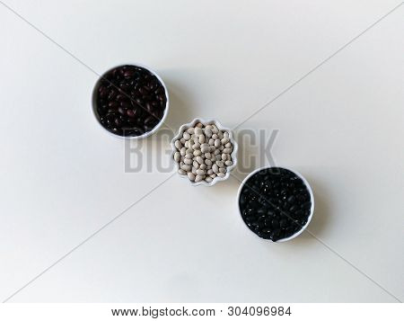 Flatley Beans In Bowls On A White Background With Space For Text. Copyspace.