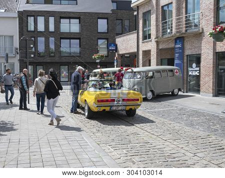 Melsele, Belgium, 30 May 2019, Yellow Mustang 428 Cobra Jet, On A Car Show With Many People In The P