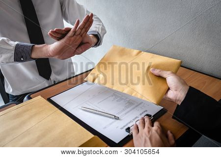 Anti Bribery And Corruption Concept, Business Man Refusing And Don't Receive Money Banknote In Envel
