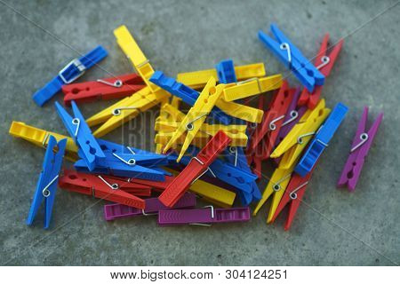 Colorful Plastic Clothespins, Clothes Pegs, Clothespins Collection, Background and Texture of Scattered Clothespins, Lots of Clothespins