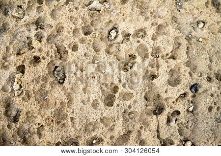 Stone Ground In Beach With Random Hollows Erosion By Wave