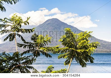 Lake Atitlan & Toliman & Atitlan Volcanoes Behind In Guatemalan Highlands.